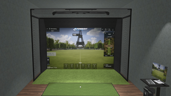 a view of a golf game on a projector screen in a golf simulator at The Concord Apartments, Sarasota , FL